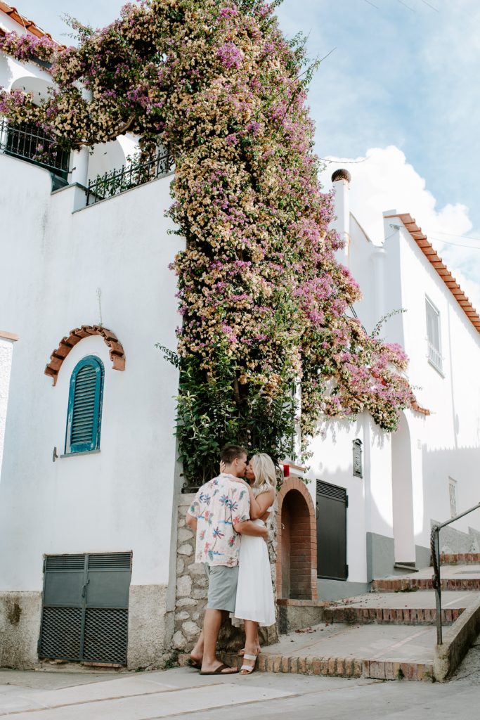 Couple wrapping their arms around each other in Capri, Italy