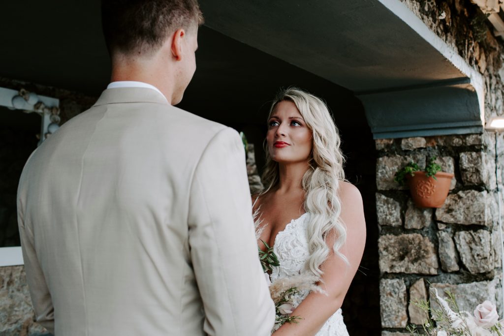 Woman looking up at her partner during their Italy wedding ceremony