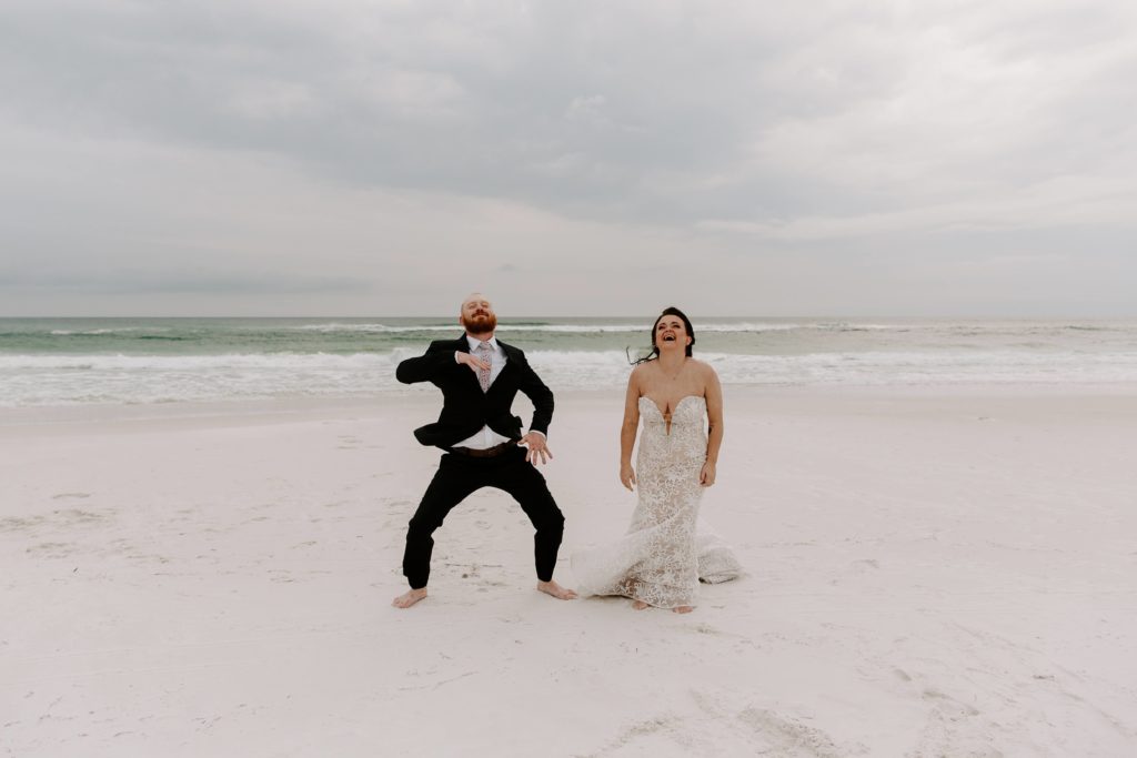 Woman laughing as her partner dances next to her with a storm brewing in the background