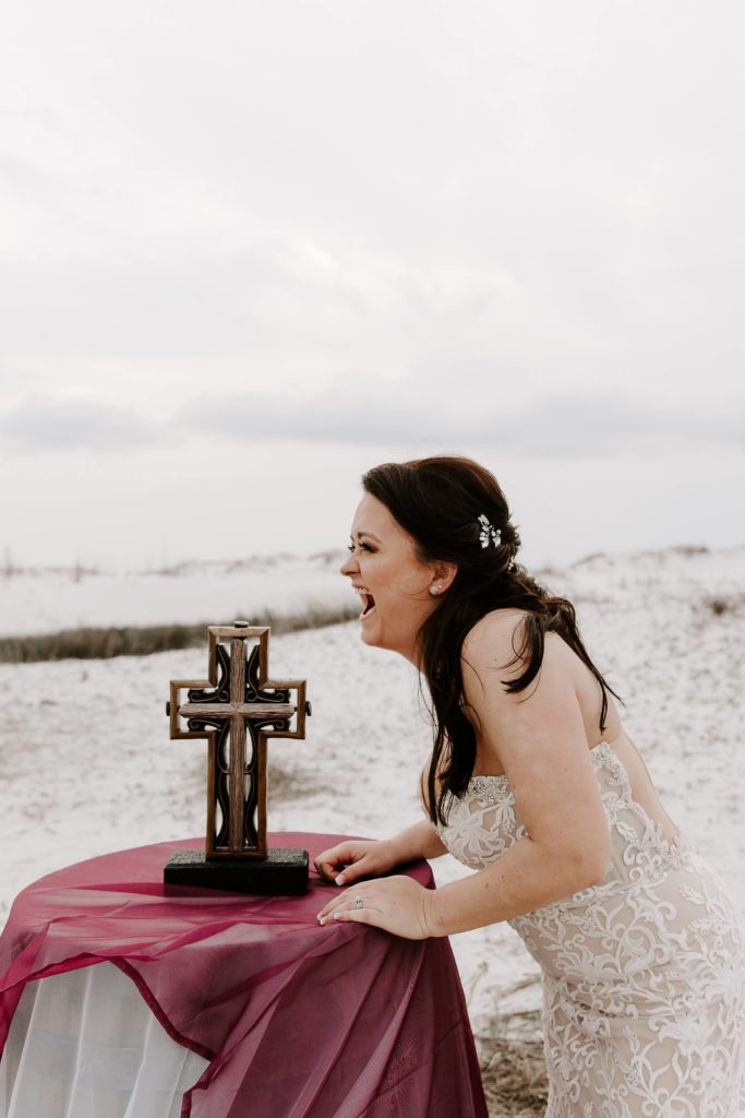 Woman laughing at something her partner said after their vow renewal in Florida