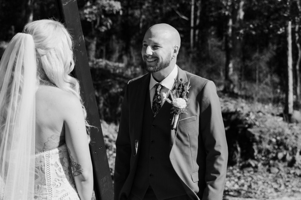 A man smiling during their Arkansas elopement ceremony