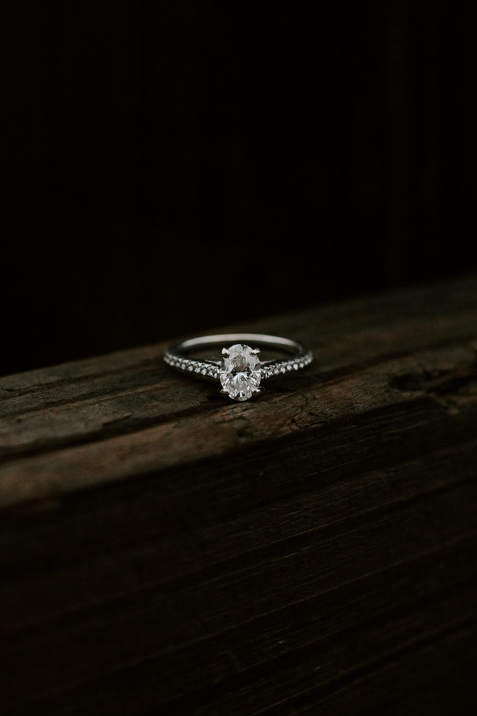 Engagement ring sitting on a beam during a Tennessee engagement session in Nashville