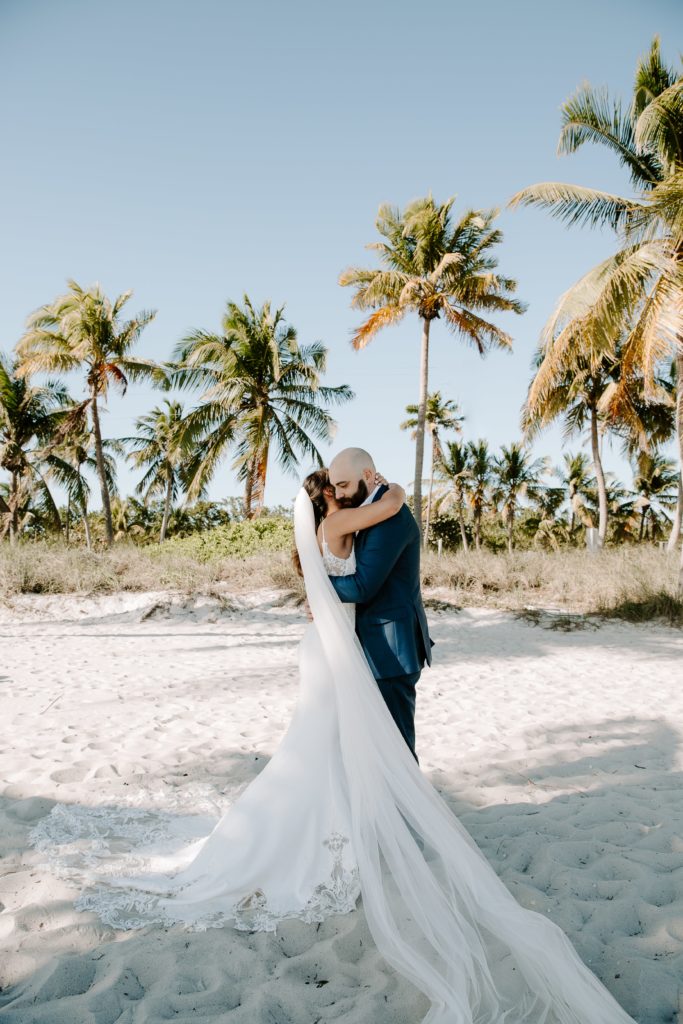 woman hugging her partner after he sees her for the first time during their Key West elopement