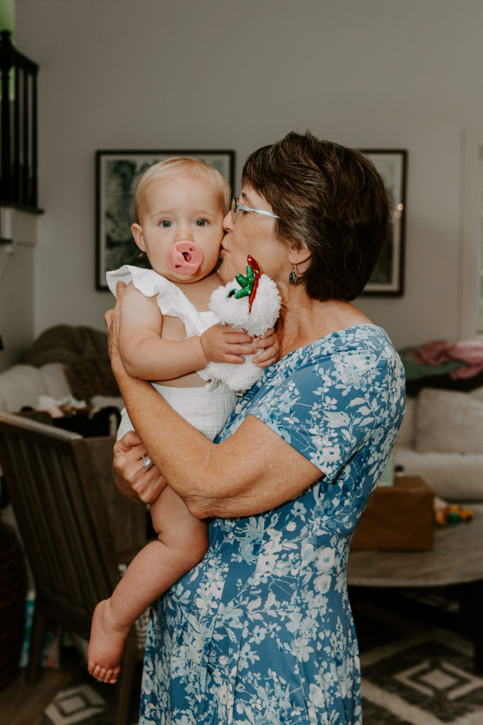 Grandmother kissing her granddaughter on the cheek during a Santa Rosa Beach intimate wedding in the Florida Panhandle
