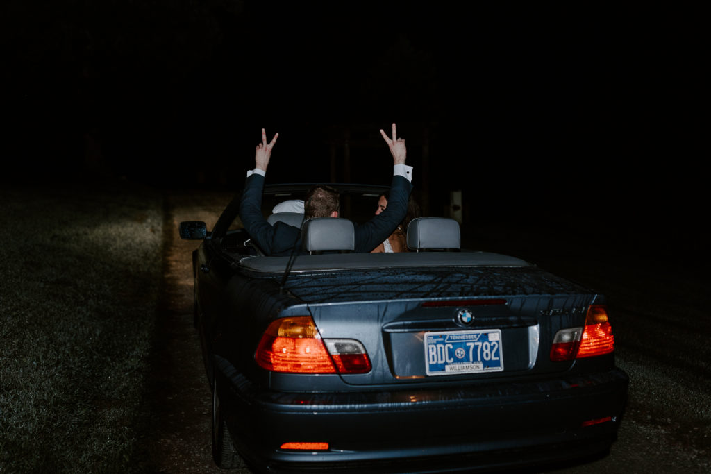 Groom throwing up peace signs