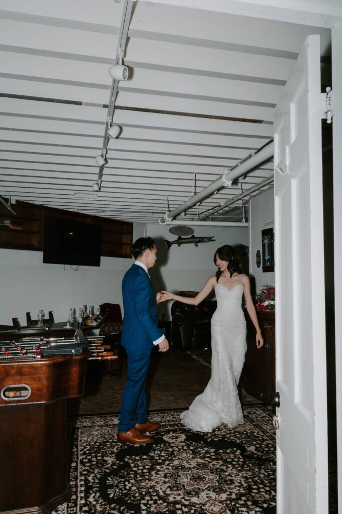 A newly wed couple practicing their first dance after their indoor wedding ceremony and before their reception during their downtown St. Augustine wedding