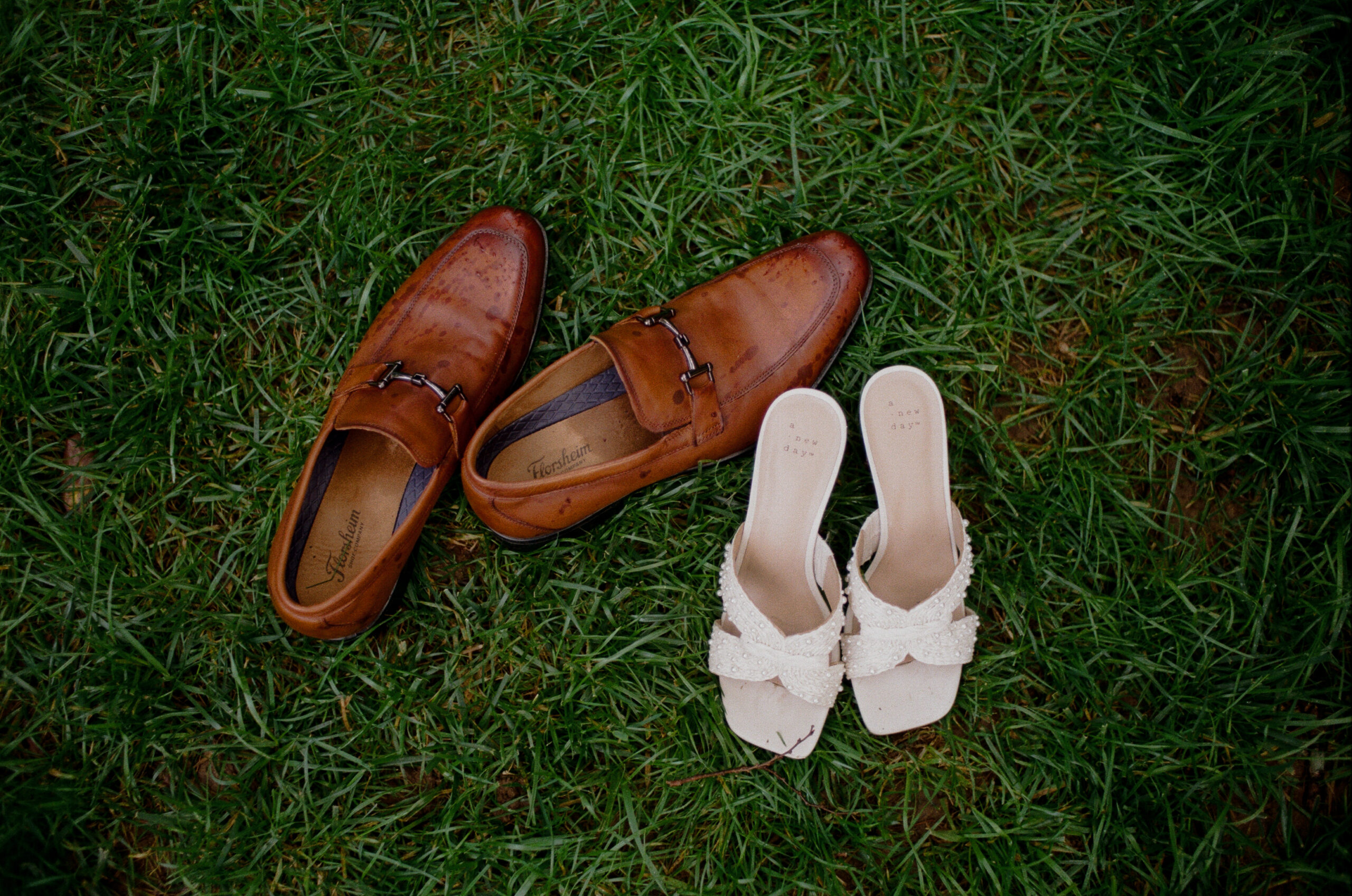 A couple's shoes sitting in the grass after they got kicked off during their engagement photos in east Tennesee