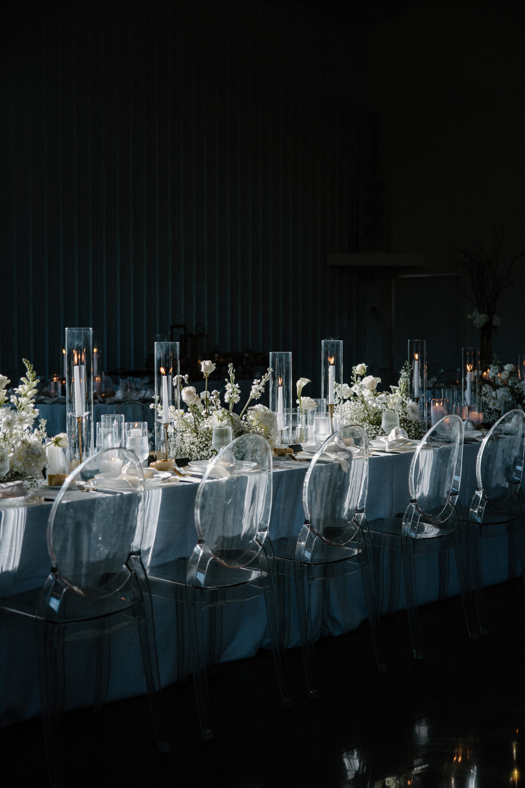 A long table with candles and flowers during a high end Nashville wedding