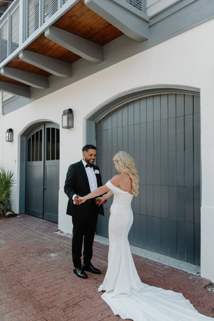 A couple sharing a first look in their wedding attire during a 30-A wedding in Rosemary Beach, Florida