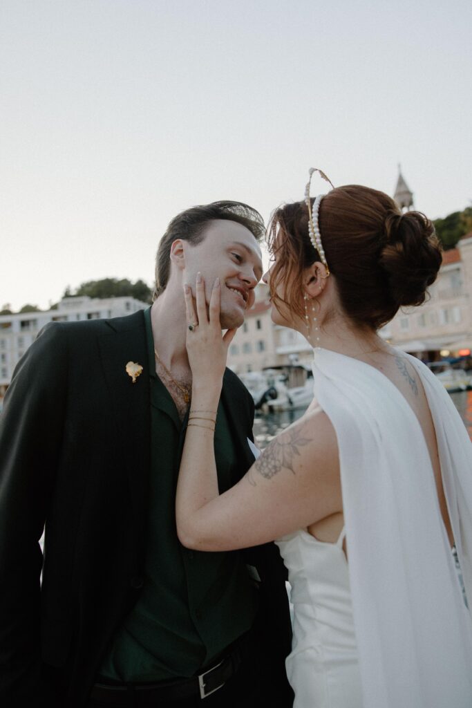 Couple sharing an intimate forehead-to-forehead moment during Hvar wedding day.