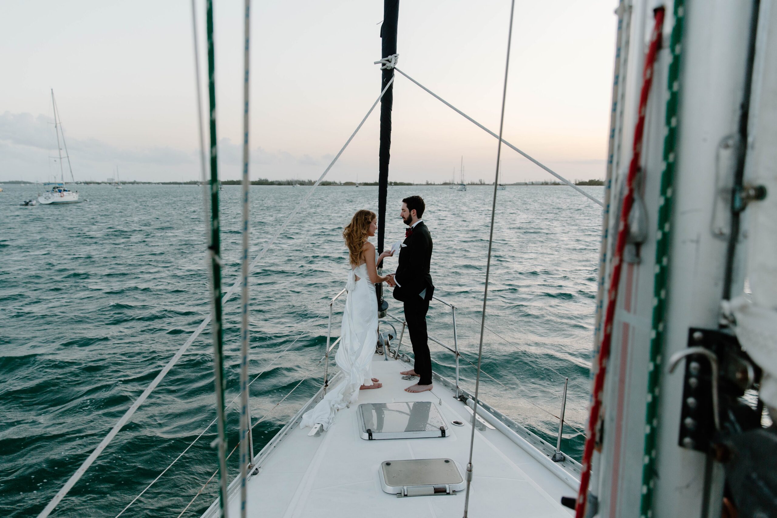 Sailboat wedding ceremony on the water during destination wedding celebration in Key West